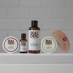 A Bulldog Skincare Beard Comb is arranged neatly on a white surface against a neutral background.