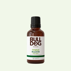 A 30 ml brown bottle of Original Beard Oil with a black cap and white label featuring green and brown text, set on a light background. Formulated with natural ingredients for superior moisturising.